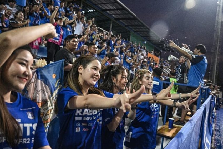 BG Pathum United's "Rabbit Girls" dance to a drumbeat and cheer their team on