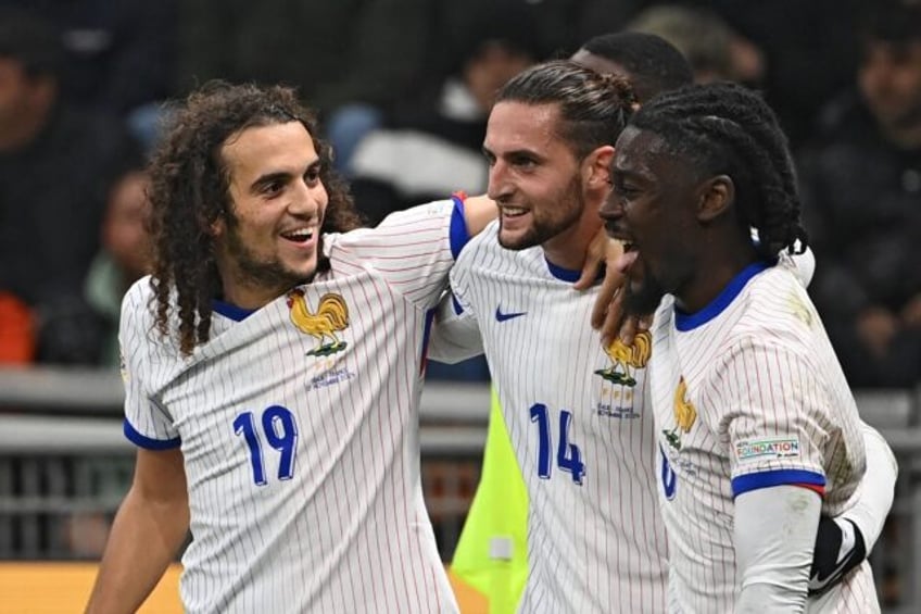 Adrien Rabiot (C) netted twice for France against Italy on Sunday