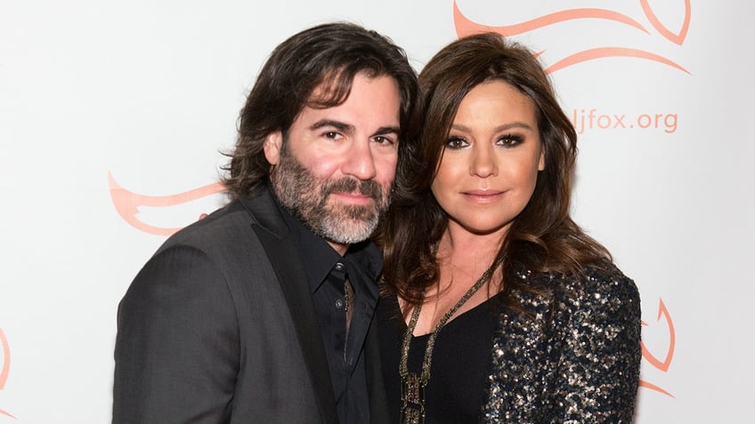 Celebrity chef Rachael Ray poses next to husband John Cusimano