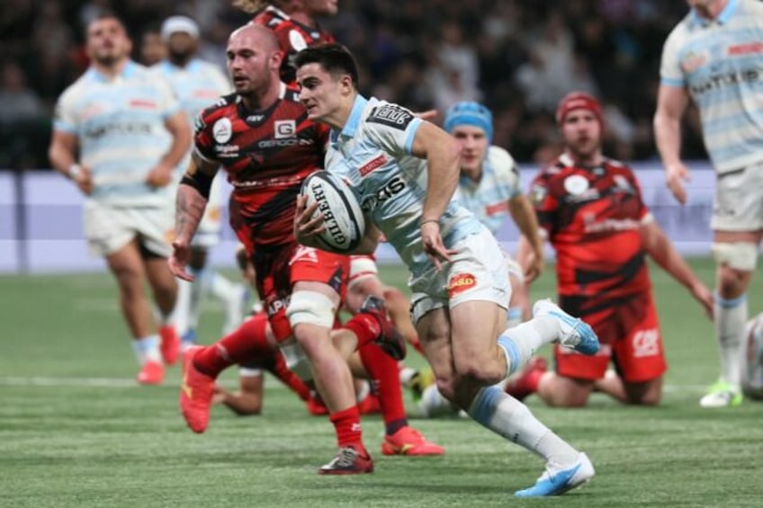 Racing 92's Nolann Le Garrec (C) scored three tries in the win over Oyonnax