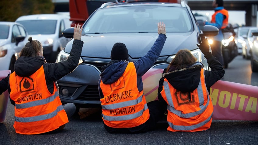 Climate protesters blocking street