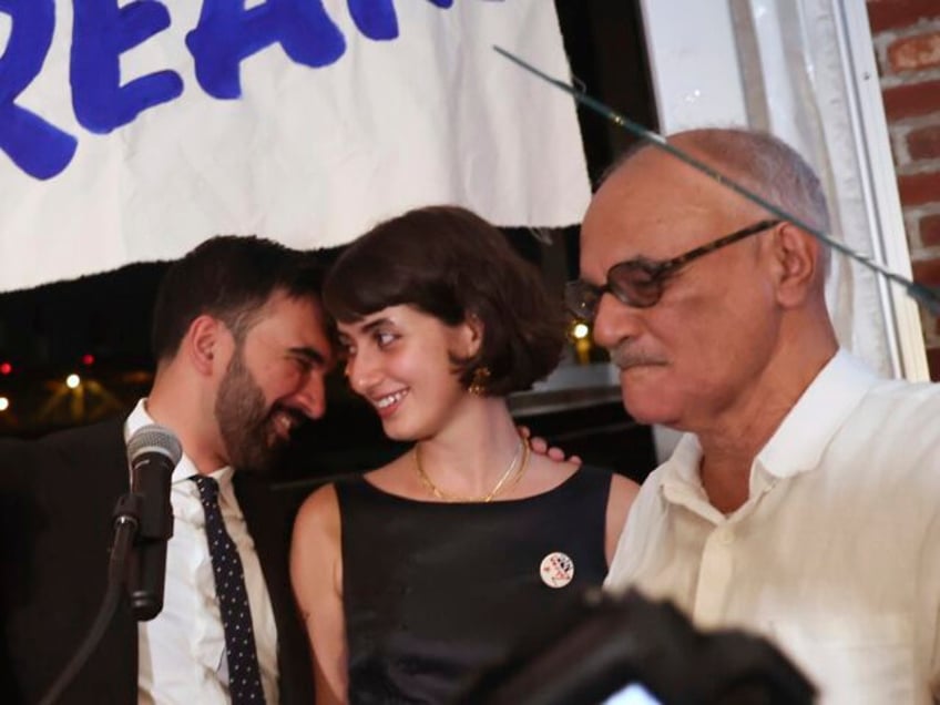 Democratic mayoral candidate Zohran Mamdani, center left, appears on stage with his wife,