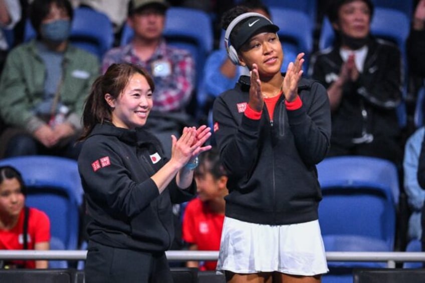 Team work: Japan's Naomi Osaka (right) celebrates Nao Hibino's victory against Kazakhstan'