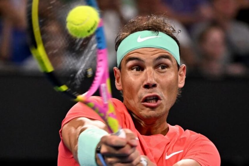 Spain's Rafael Nadal hits a return against Austria's Dominic Thiem at the Brisbane International