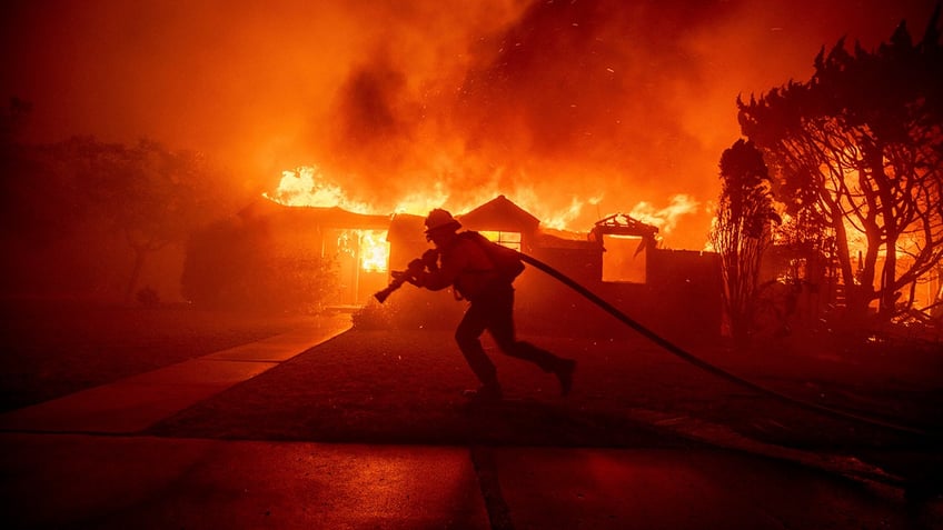 Firefighter battles a fire