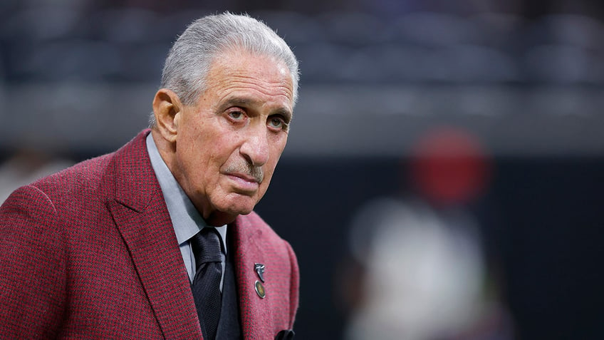 Atlanta Falcons owner Arthur Blank stares