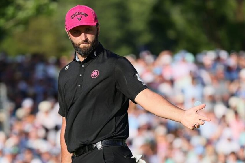 Spain's Jon Rahm reacts to a missed putt on the 18th green during the final round of the P