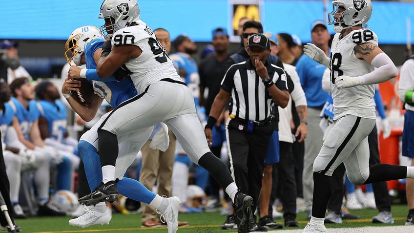 raiders jerry tillery ejected after hit on chargers star justin herbert