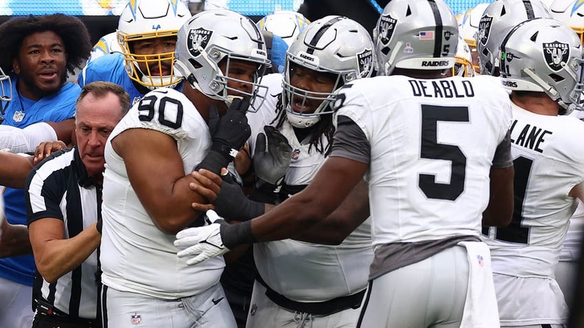 raiders jerry tillery ejected after hit on chargers star justin herbert