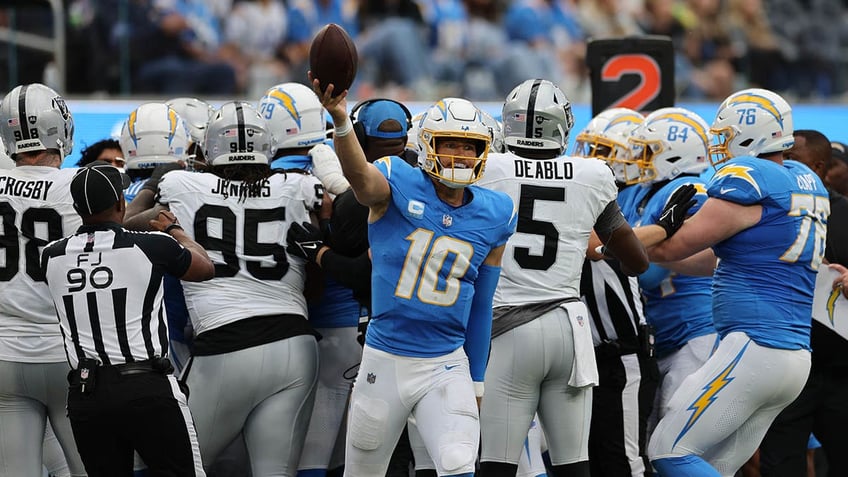 raiders jerry tillery ejected after hit on chargers star justin herbert