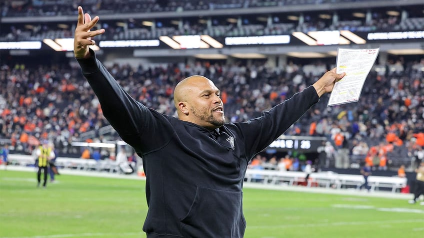 Antonio Pierce gestures to the fans