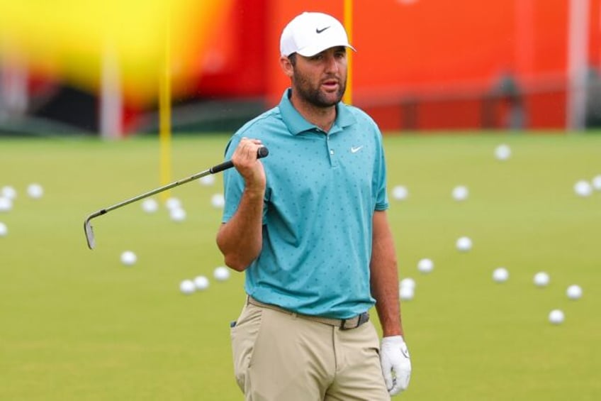 World number one Scottie Scheffler of the United States warms up at the driving range on t