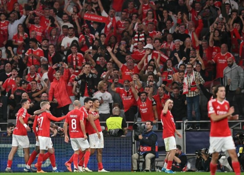 Benfica defender Alexander Bah (C) celebrates scoring his team's third goal in the rout of