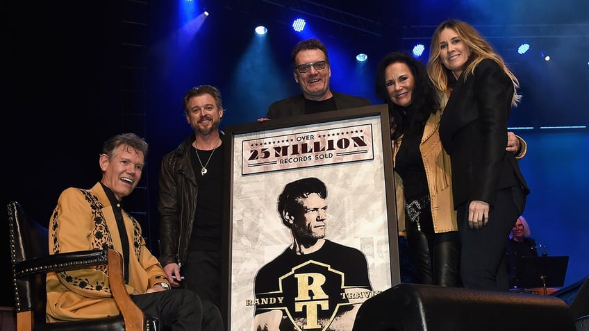 Randy Travis with Mary Travis and Cris Lacy on stage together