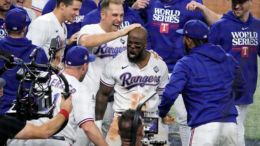 rangers adolis garcia blasts walk off home run in 11th to complete comeback in game 1 of world series