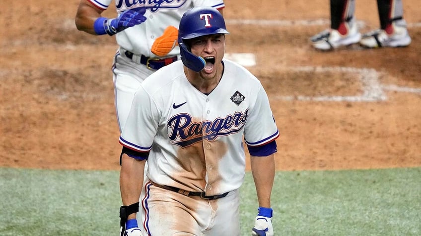 rangers adolis garcia blasts walk off home run in 11th to complete comeback in game 1 of world series