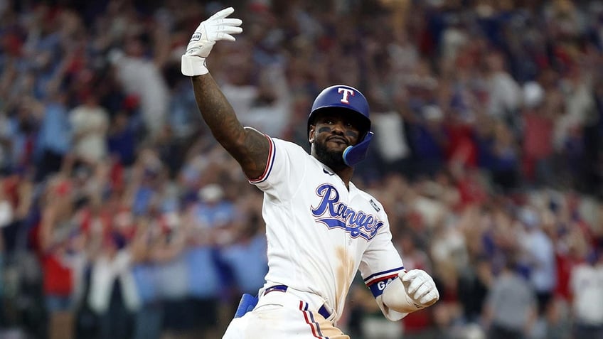 rangers adolis garcia blasts walk off home run in 11th to complete comeback in game 1 of world series