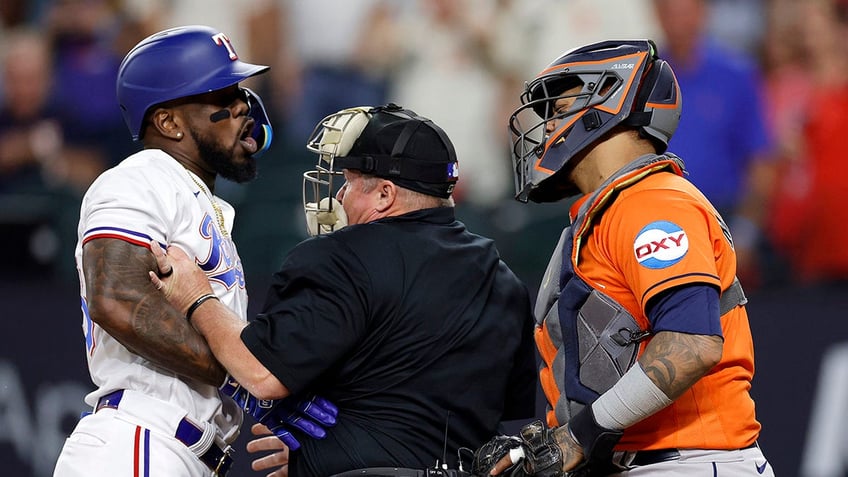 rangers adolis garcia hit by pitch and benches clear sparking ejections jose altuve hits go ahead homer