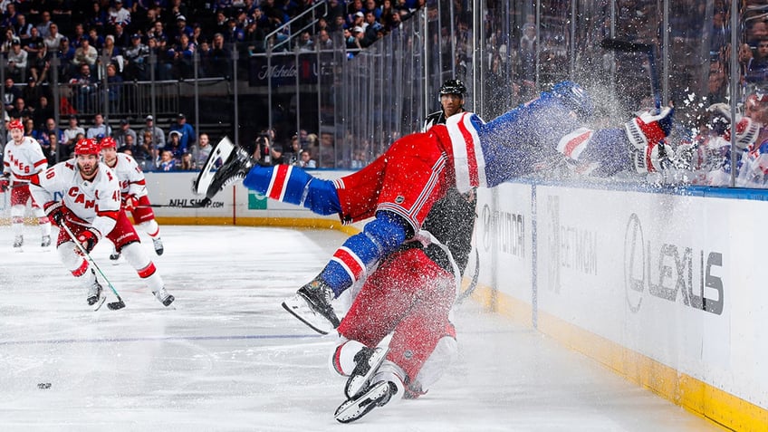 Trouba flying into boards