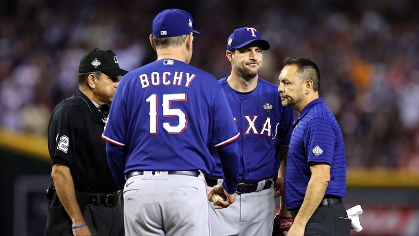 rangers max scherzer exits world series game 3 start with apparent back injury