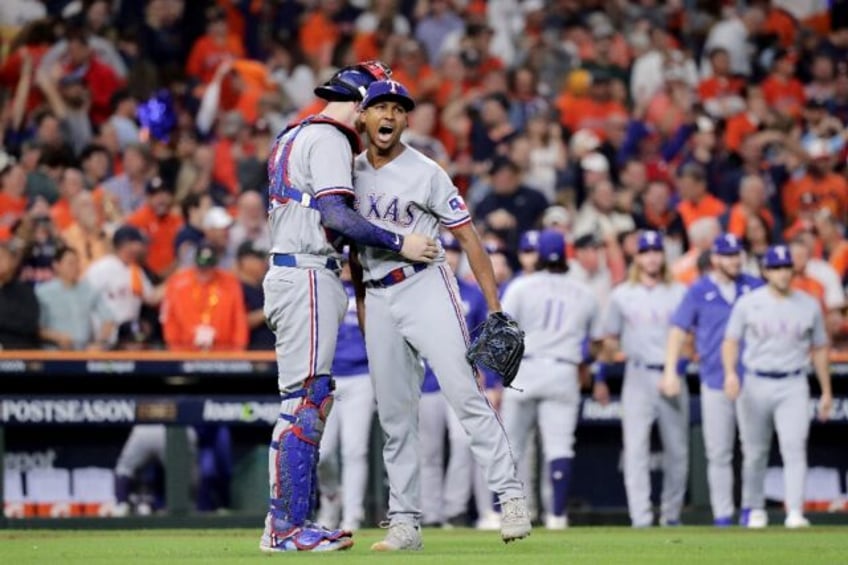 rangers take 2 0 lead over champion astros in mlb playoffs