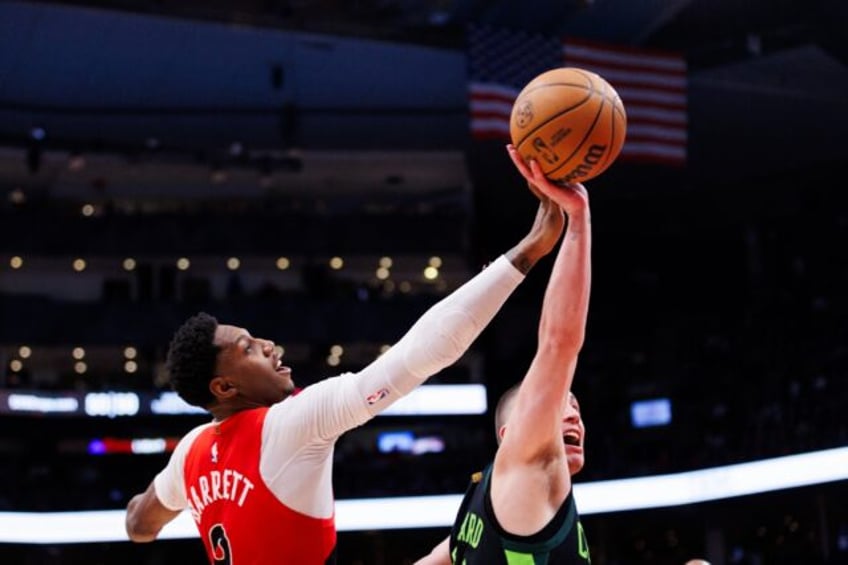 Toronto's RJ Barrett tussles with Boston's Payton Pritchard in the Raptors' upset defeat o