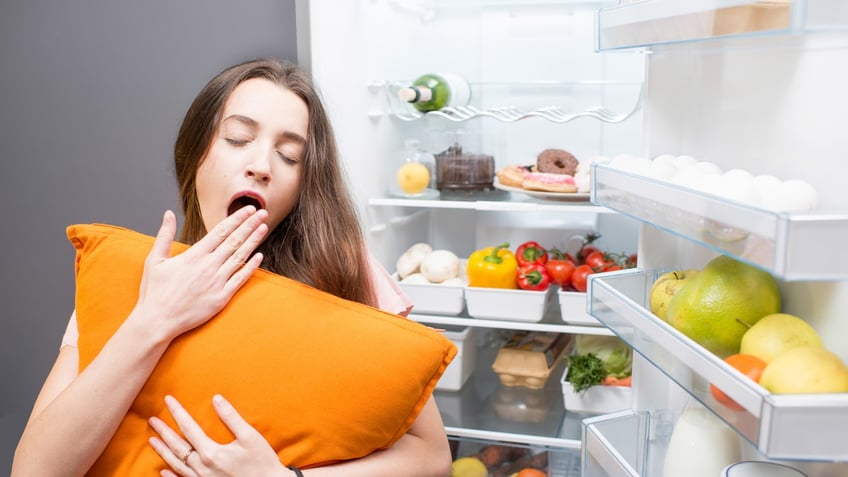 Woman tired fridge