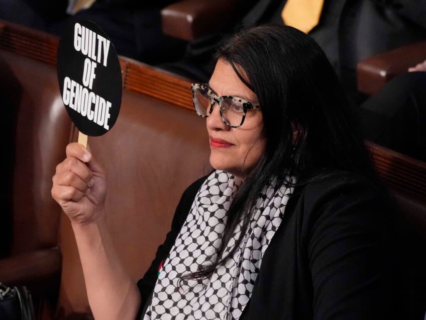 rashida tlaib holds up war criminal sign during netanyahu speech