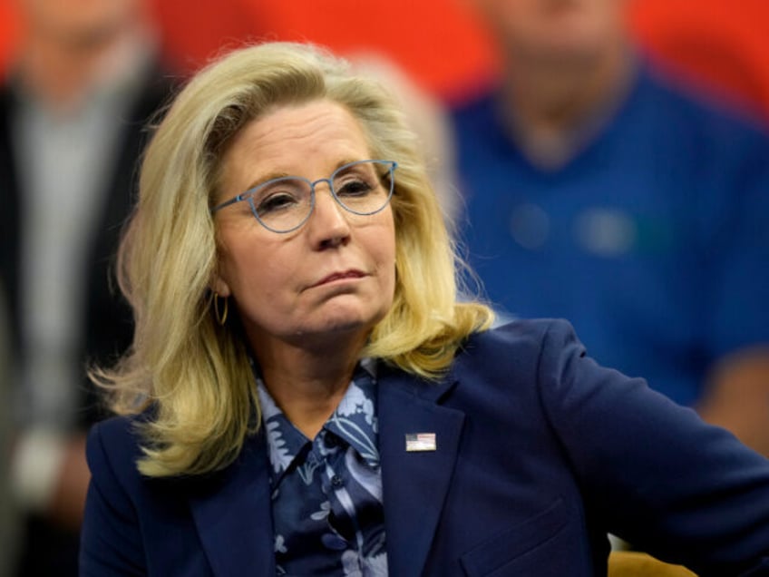 Former Republican Congresswoman Liz Cheney listens during a town hall with Democratic pres