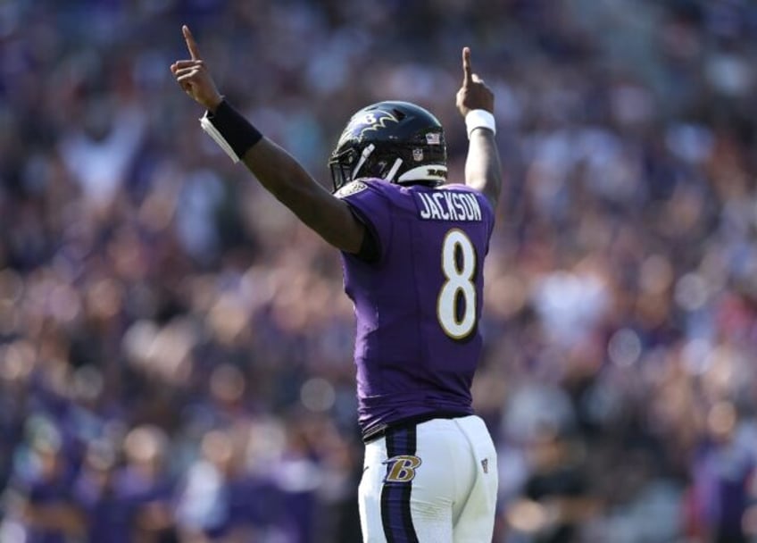 Lamar Jackson celebrates a Derrick Henry touchdown run as the Baltimore Ravens beat Washin