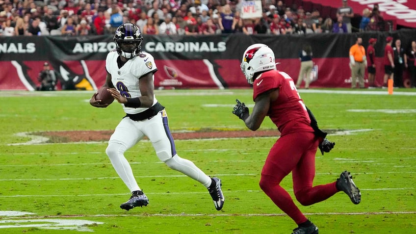 ravens win over cardinals behind gus edwards three touchdowns