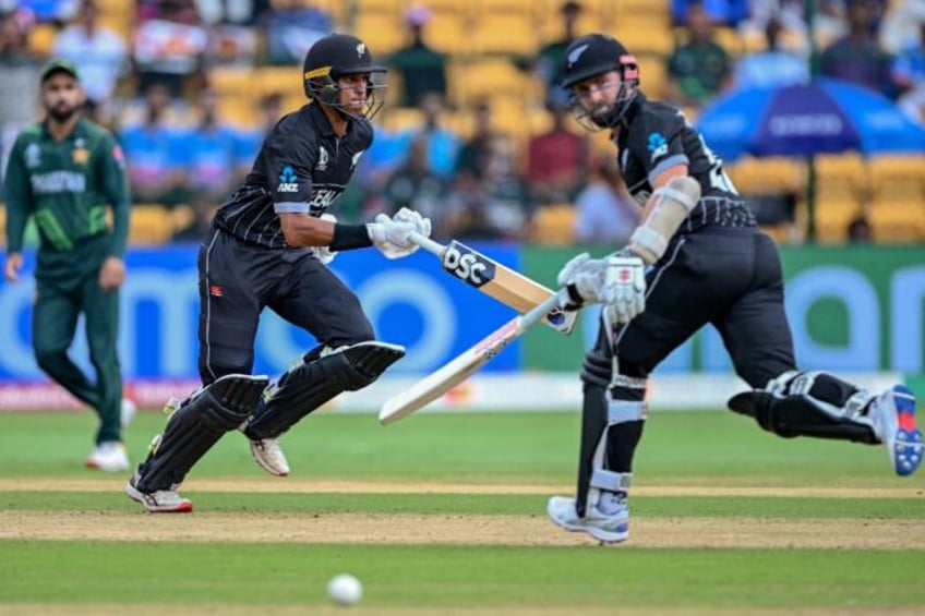 ravindra hits century as new zealand pile up trouble for pakistan