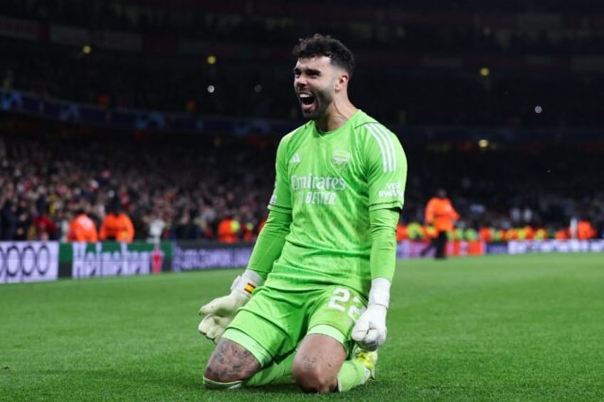 David Raya celebrates after Arsenal won a penalty shootout against Porto to reach the Cham