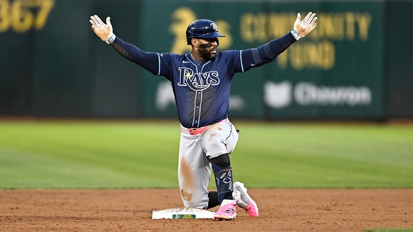 Yandy Diaz reacts after hit