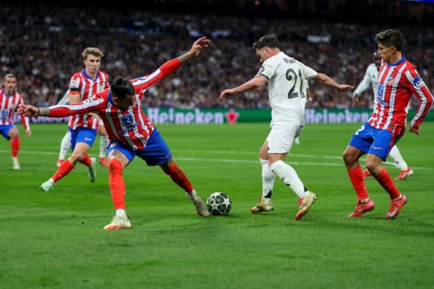 Brahim Diaz (in white) dances through the Atletico Madrid defence before hitting the Real