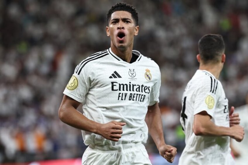 Real Madrid's English midfielder Jude Bellingham celebrates scoring his team's first goal