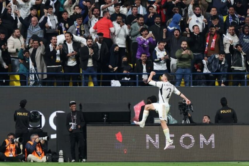 Real Madrid's Spanish defender Dani Carvajal celebrates scoring his team's third goal and played a key role in the win over Atletico