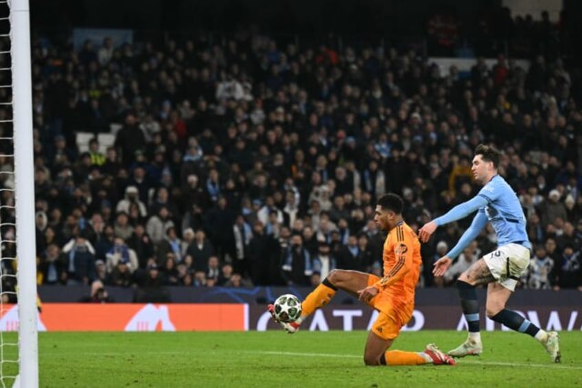 Jude Bellingham slides in to score the winning goal for Real Madrid in stoppage time