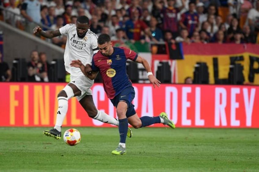 Real Madrid's German defender Antonio Rudiger was sent off for throwing an object at the r