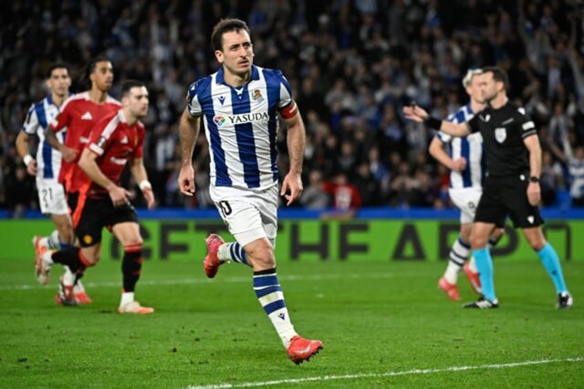 Real Sociedad's Spanish striker Mikel Oyarzabal (C) celebrates converting a penalty agains