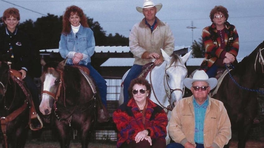 reba mcentire with her family on the ranch