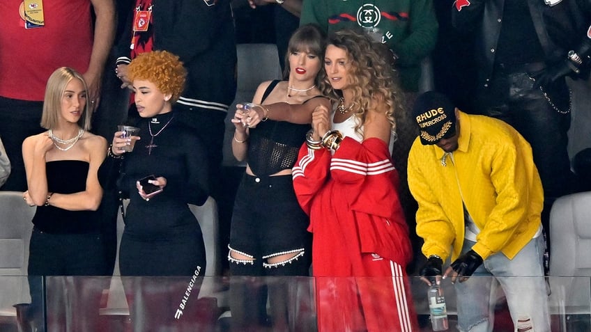 Ashley Avignone, from left, Ice Spice, Taylor Swift and Blake Lively in the stands at Super Bowl LVIII