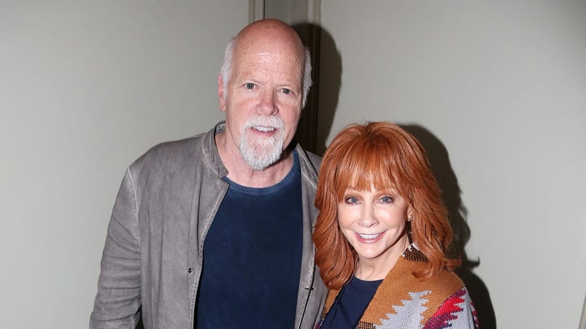 Rex Linn and Reba McEntire posing together