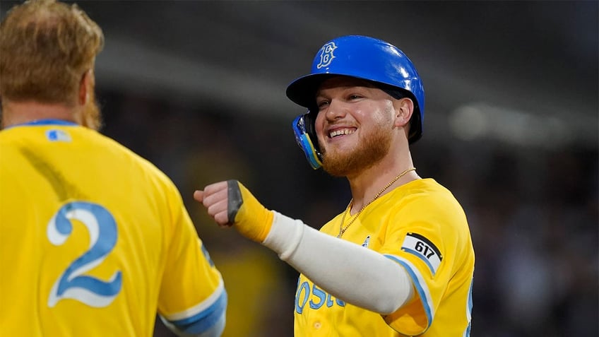 Alex Verdugo celebrates with Justin Turner