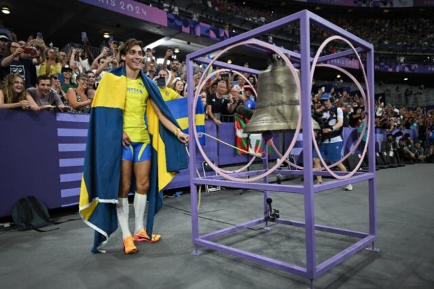 Sweden's Armand Duplantis celebrates at the victory bell