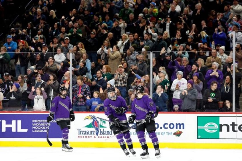 Minnesota's Grace Zumwinkle celebrates scoring against Montreal before a world record crowd on Saturday