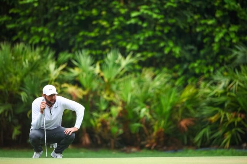 Scottie Scheffler looks over a putt on the 12th hole during the final round of the RBC Her