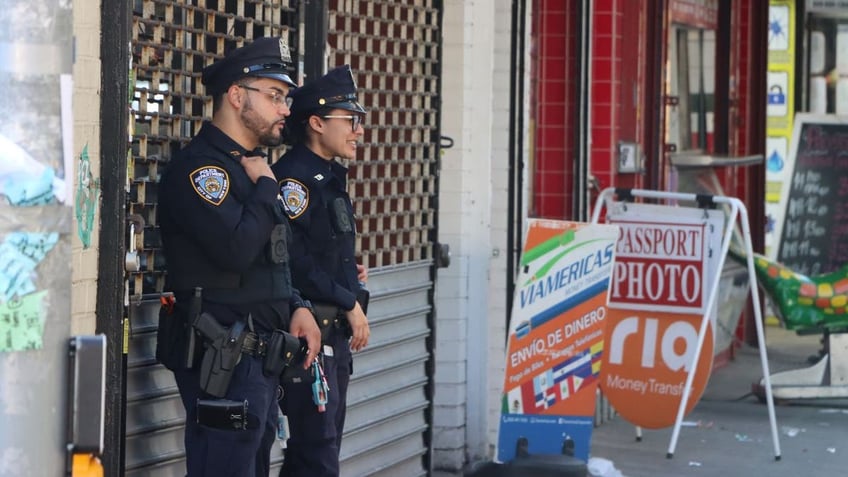 Police on Roosevelt Avenue during the 90 day operation