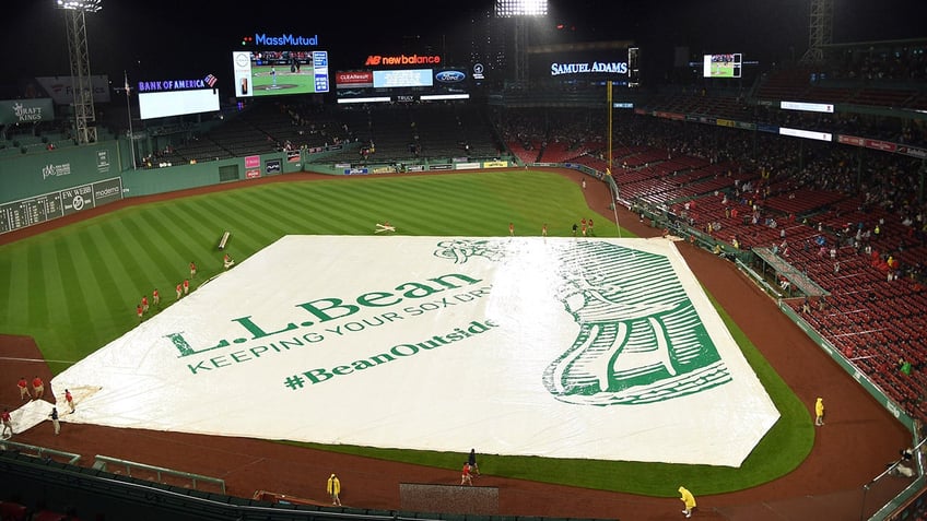 red sox fans take advantage of flooded fenway park during rain delay