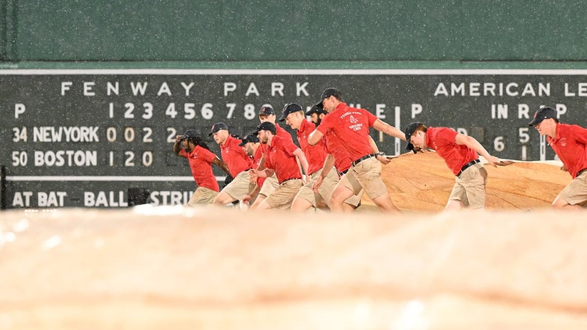 red sox fans take advantage of flooded fenway park during rain delay